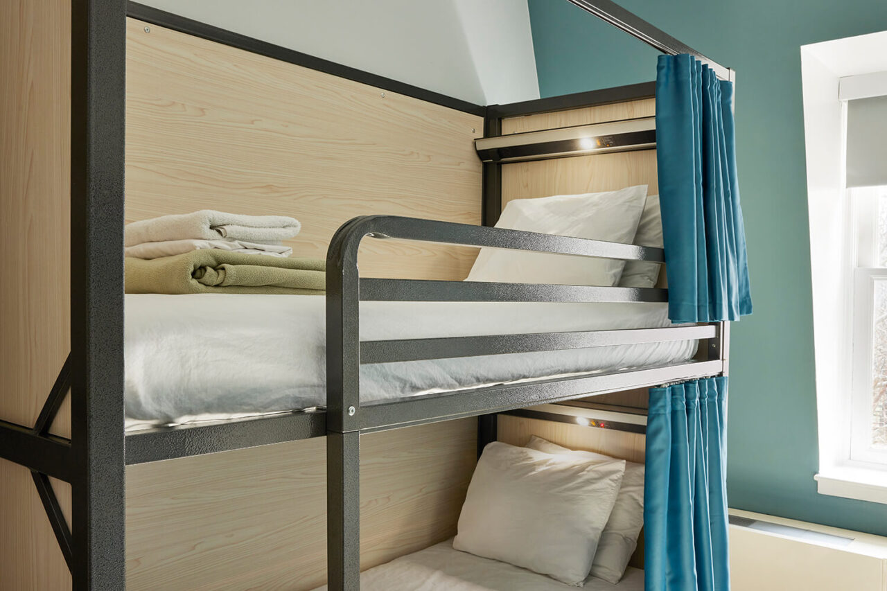 all bunks at HI New York City hostel have been updated with privacy screens, privacy curtains, individual reading lights, and charging ports.