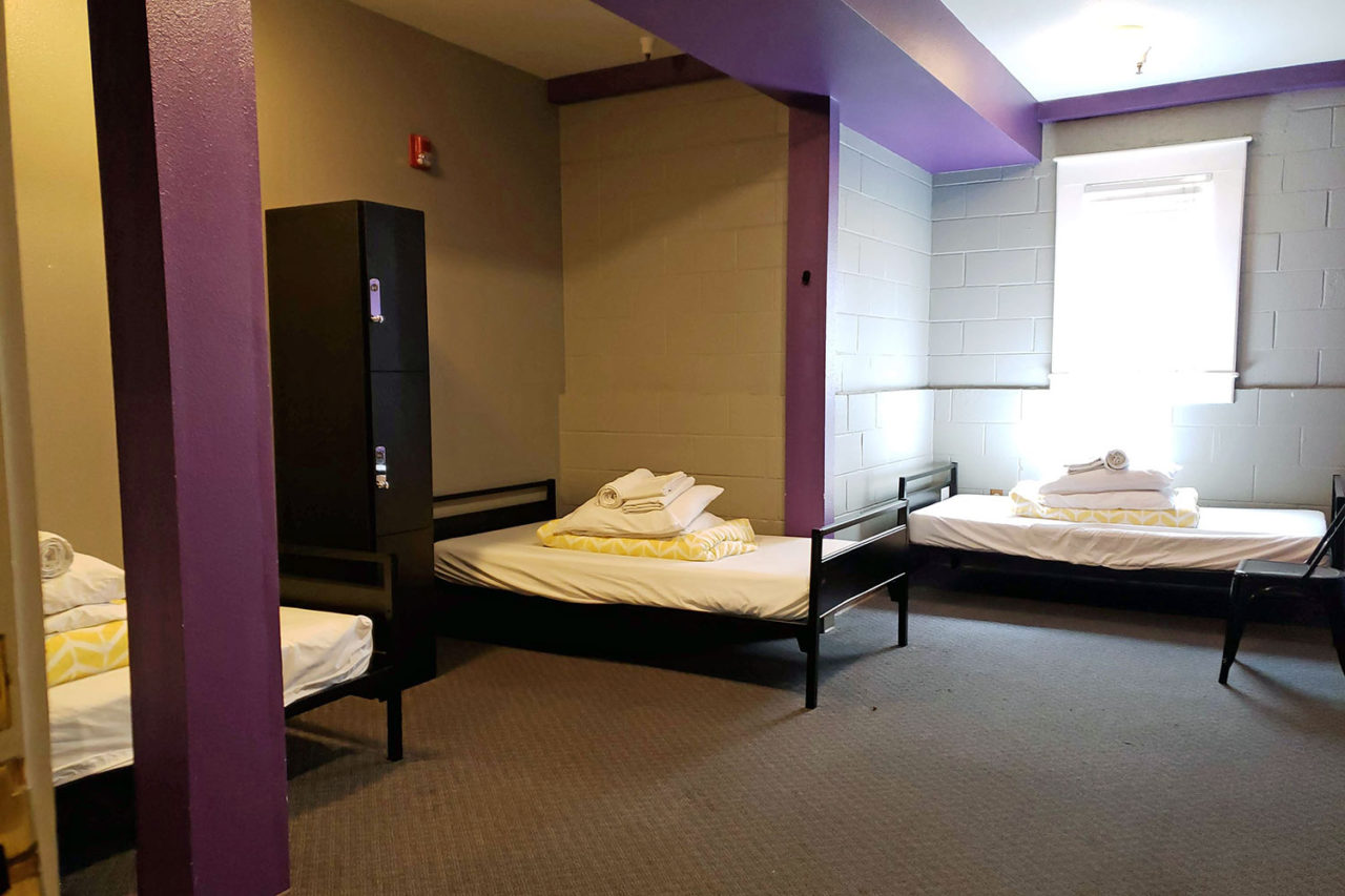 a private triple room at HI Sacramento hostel with three twin-sized bunk beds