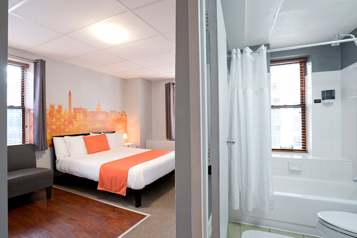 Room view with queen bed and private bathroom.