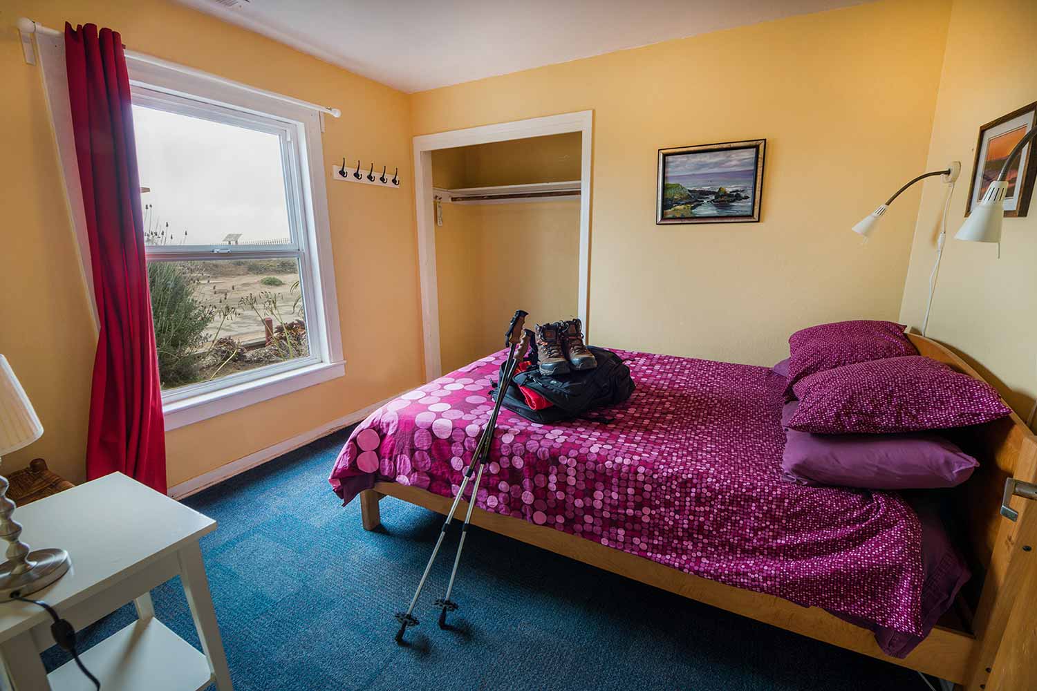 a private room with a freshly made full-sized bed at HI Pigeon Point Lighthouse hostel