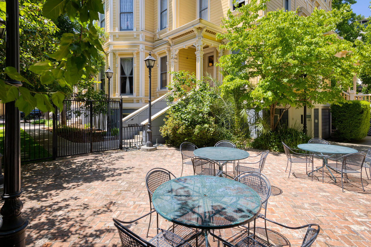 The sunny courtyard at HI Sacramento hostel is the perfect spot for guests to relax outside