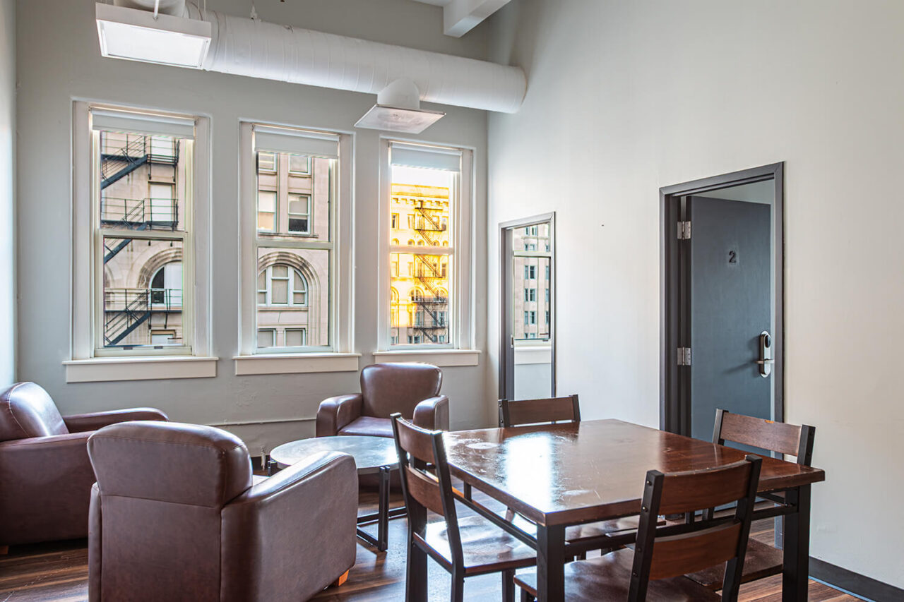 A guest suite at HI Chicago hostel with a private lounge area