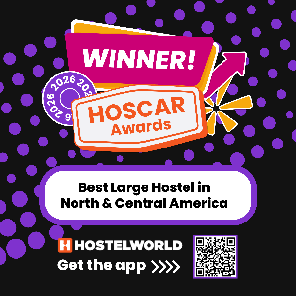 A colorful badge announcing HI New Orleans hostel as the winner of the Best Large Hostel in North & Central America for 2025 by Hostelworld.