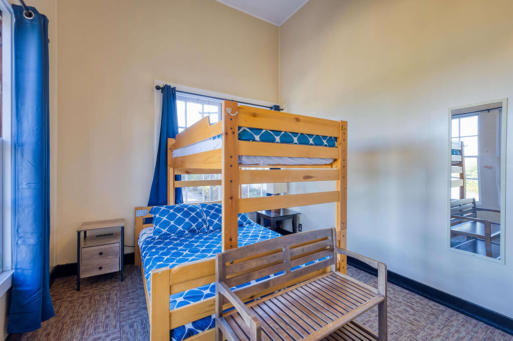 a private room at HI San Francisco Fisherman's Wharf hostel with one full-sized bed with a twin-sized bed bunked over it