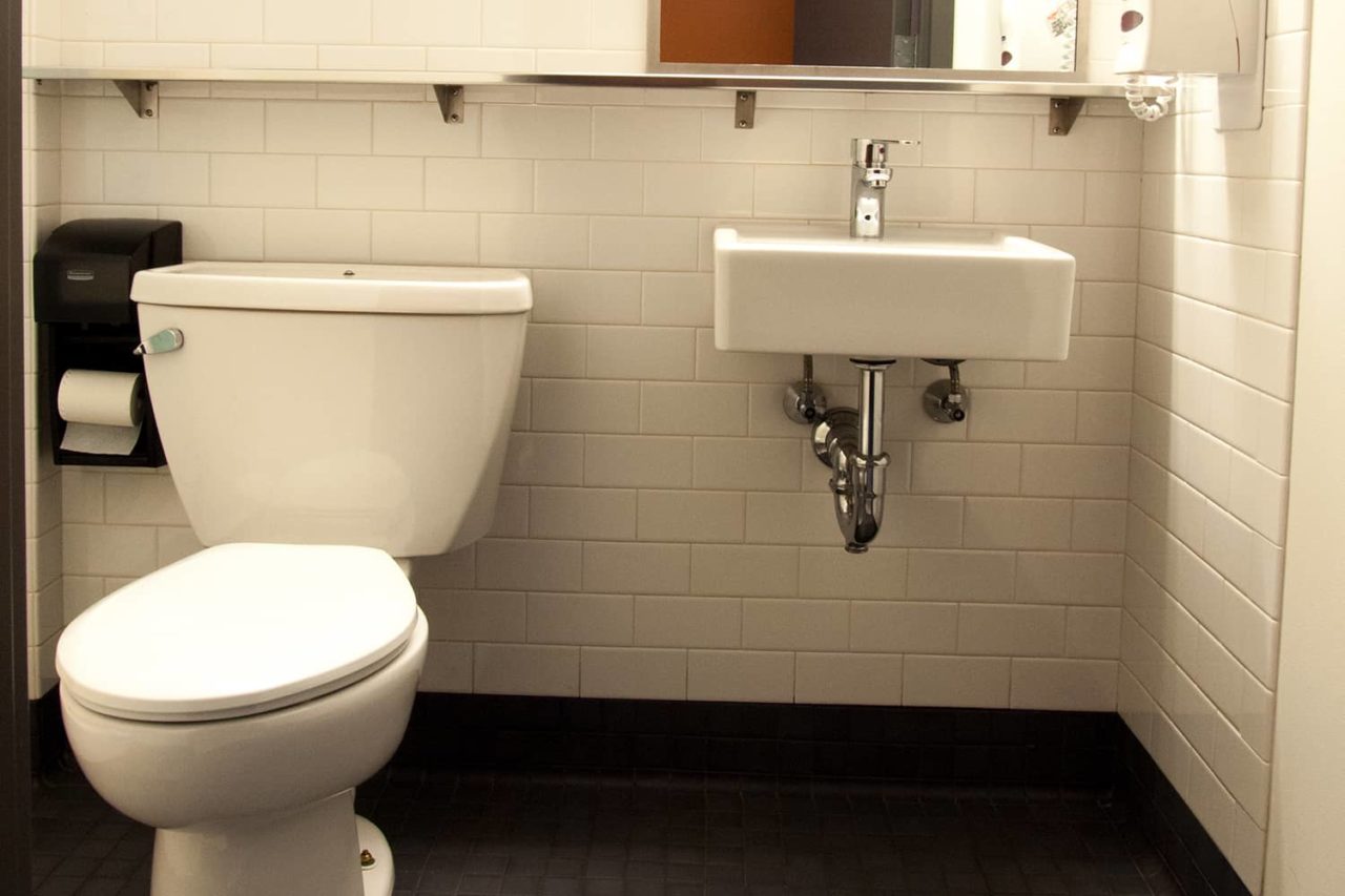 single-occupancy bathrooms at HI Boston hostel feature frequently cleaned toilets, sinks, and showers