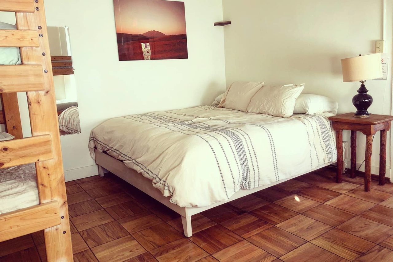 a bedroom in the historic lodge at HI Point Reyes