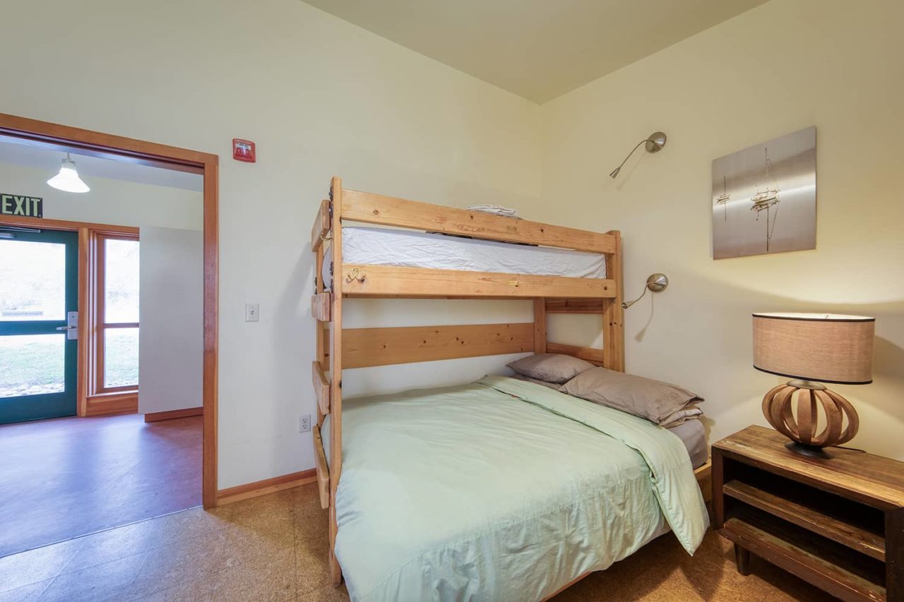 a twin bed bunked over a full-sized bed
