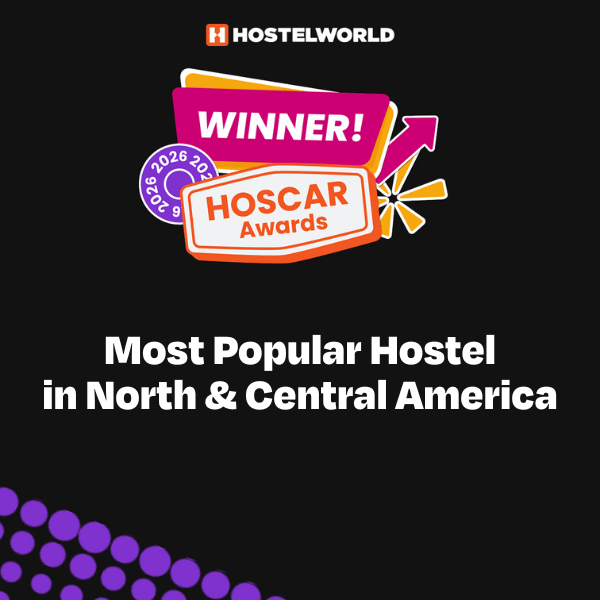 A colorful badge announcing HI Los Angeles Santa Monica as the winner of Hostelworld's 2025 Hoscar award for Most Popular Hostel in North & Central America.