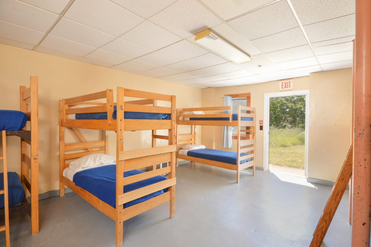 a clean and bright dorm room at HI Truro hostel