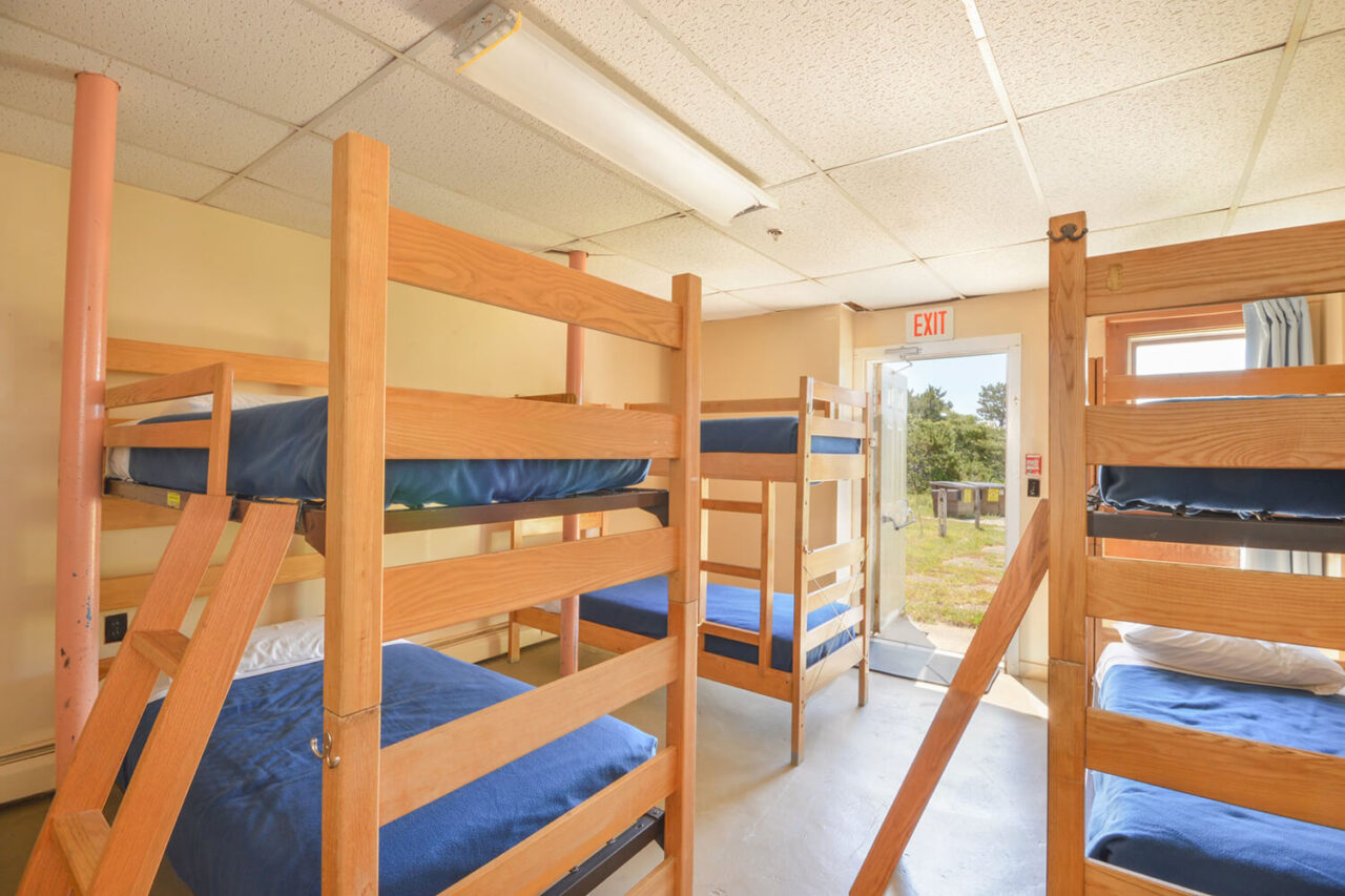 a clean and bright dorm room at HI Truro hostel