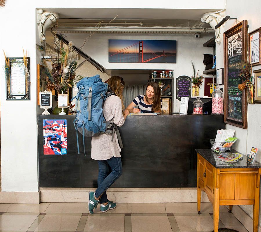 A person checking into a hostel in San Francisco
