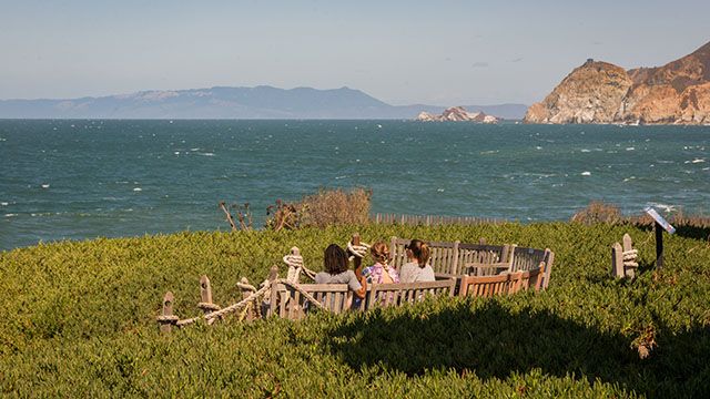 3 women looking at the ocean at Point Montara Lighthouse