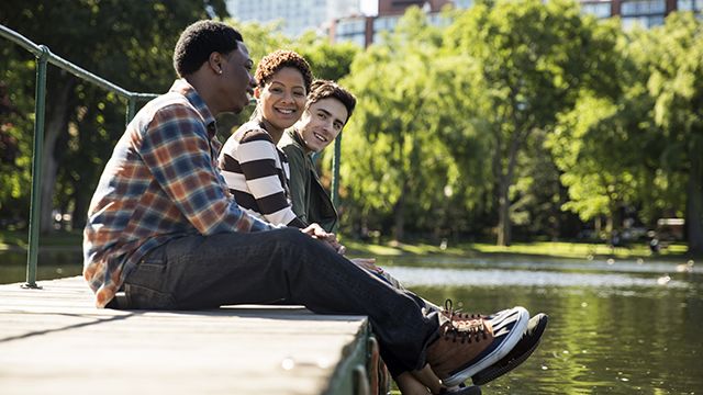 a group of travelers at the Boston Public Garden