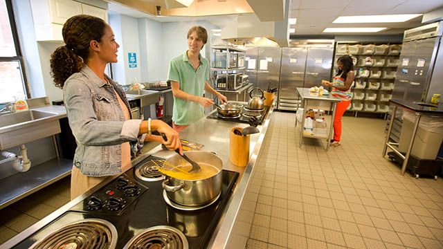 travelers in a hostel kitchen