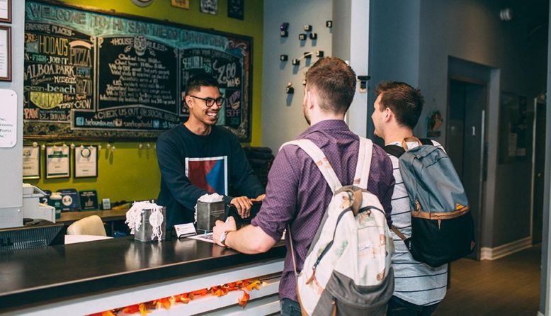 guests checking into a hostel