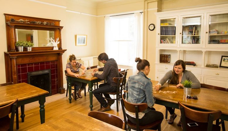 travelers playing board games at HI Marin Headlands hostel