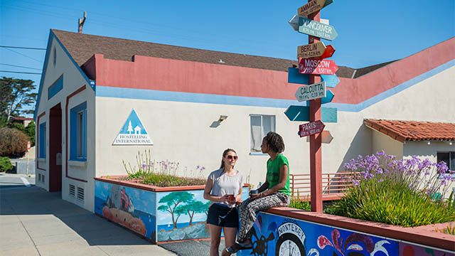 two women in front of HI Monterey hostel