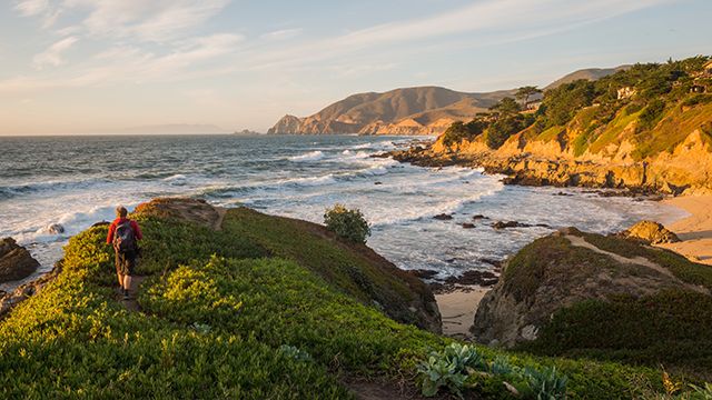 a hiker near Point Montara Lighthouse