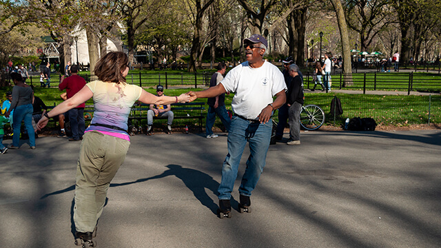 a couple roller skates in Central Park