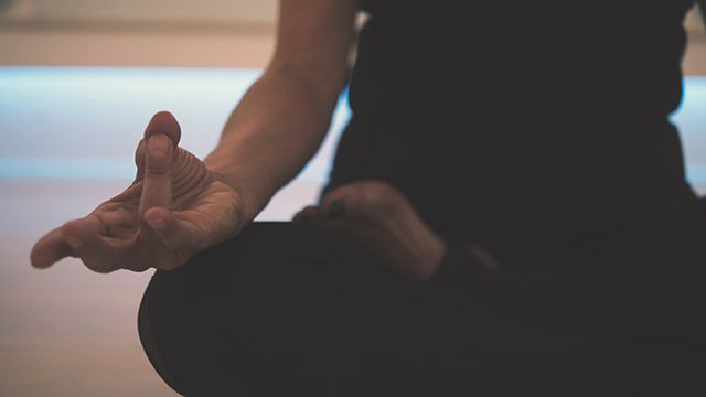 a woman in a yoga class