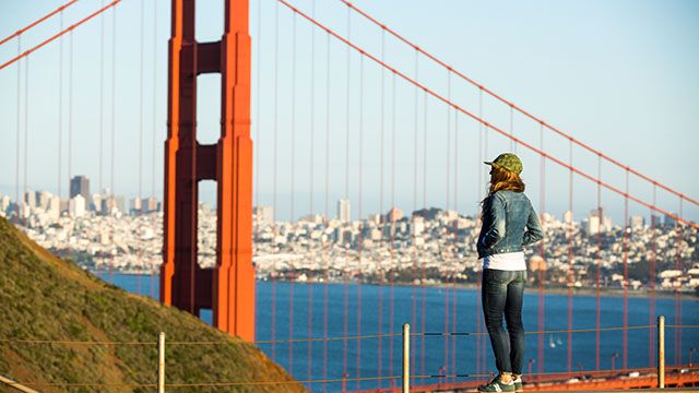 woman looking out over the golden gate bridge