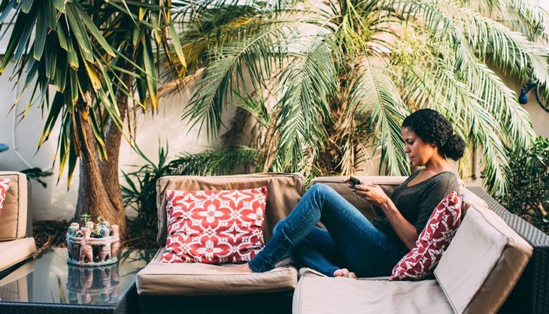 woman relaxing in a hostel back yard