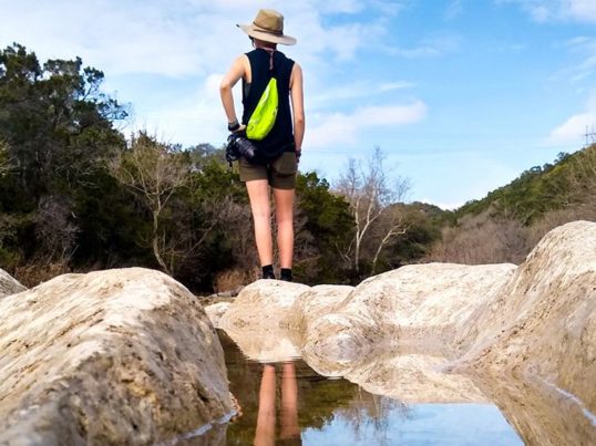 a hiker on the Barton Springs trail in Austin