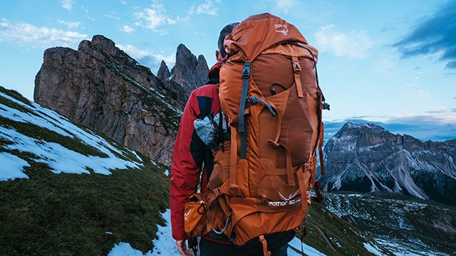 view of a backpacker in the mountains