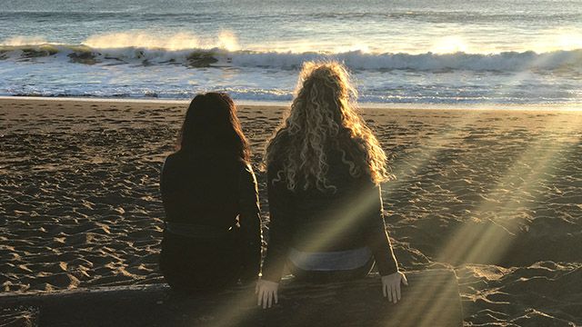 women at sunset on rodeo beach