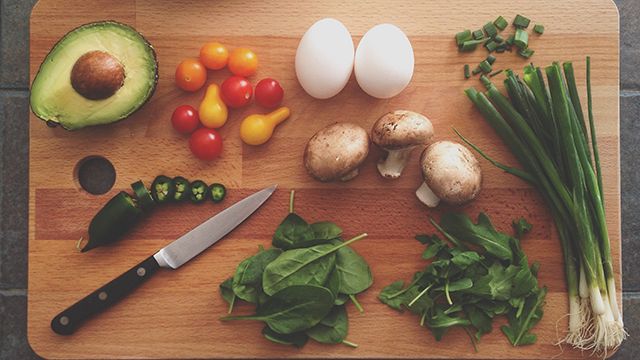 a cutting board full of vegetables