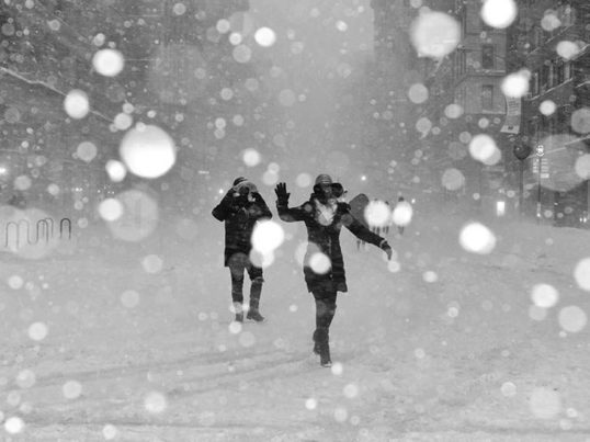 Two people dancing in the snow