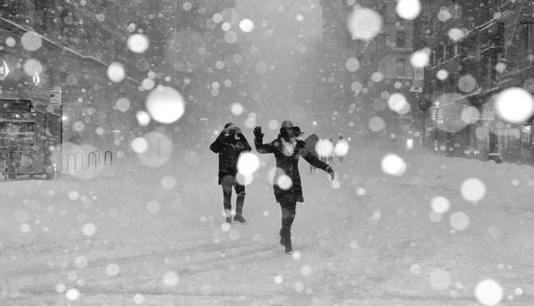 Two people dancing in the snow