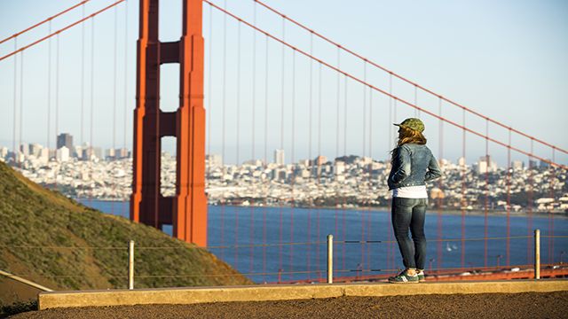 woman looking out over the golden gate bridge