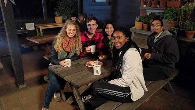 group of travelers on the patio at HI Point Reyes in the evening