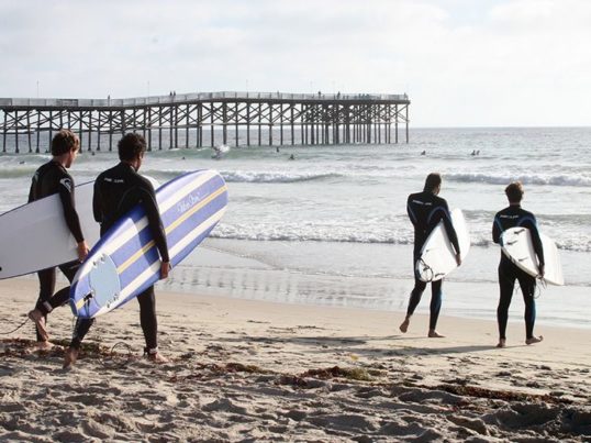 surfers at pacific beach in san diego