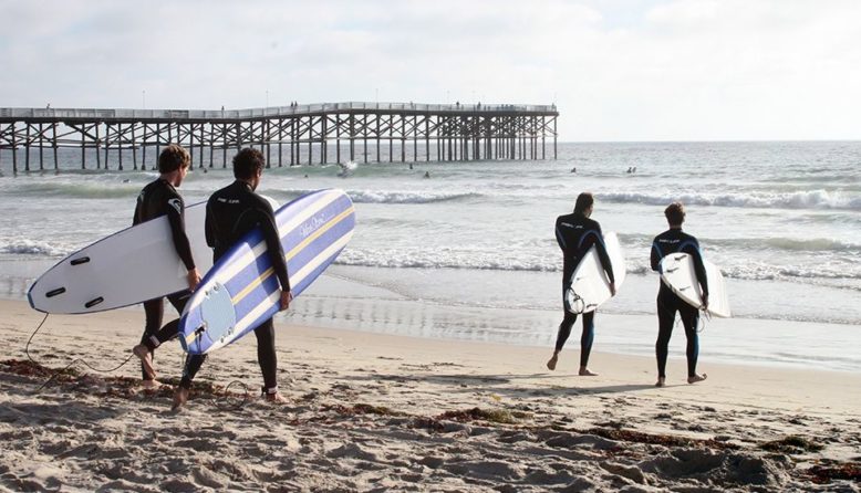 surfers at pacific beach in san diego