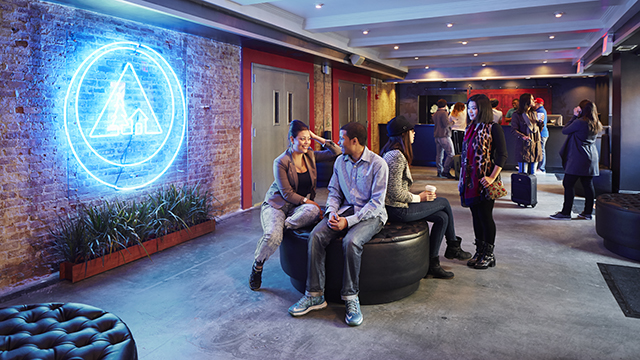 travelers in the lobby of HI NYC hostel