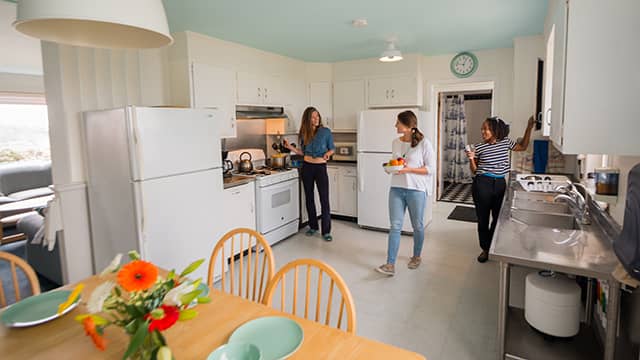 guests using the kitchen at HI Pigeon Point lighthouse