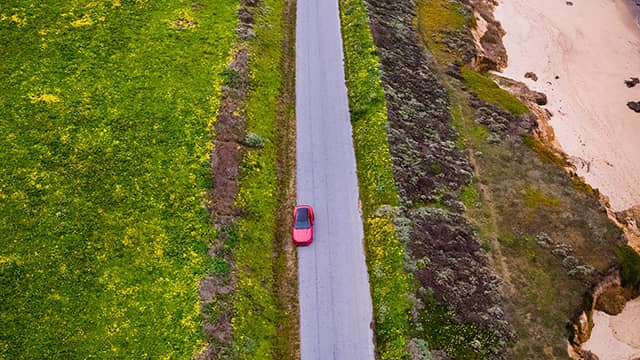 a car driving down coastal Hwy 1