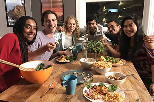 a group of travelers eating dinner at HI San Francisco downtown hostel