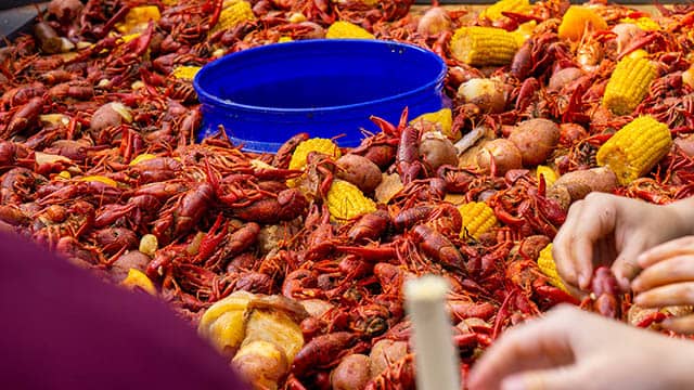 a pile of boiled crawfish with lemons 