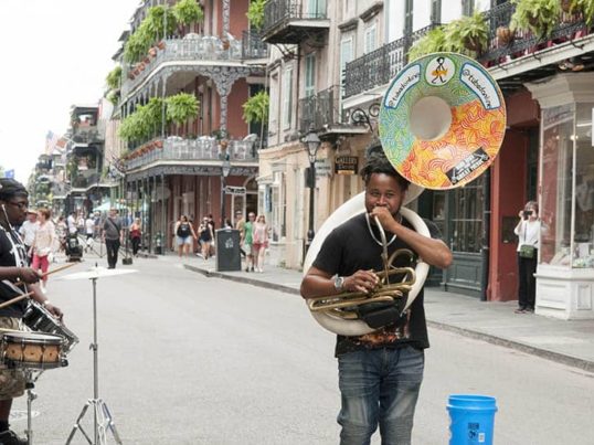 a musician plays in the french quarter of new orleans