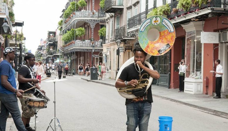 a musician plays in the french quarter of new orleans