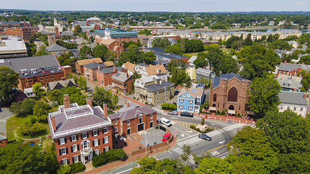 an aerial view of Salem, Massachusetts, with quaint brick buildings and green leafy trees