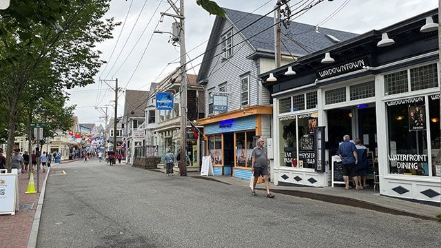 people walking past quaint shops in provincetown MA