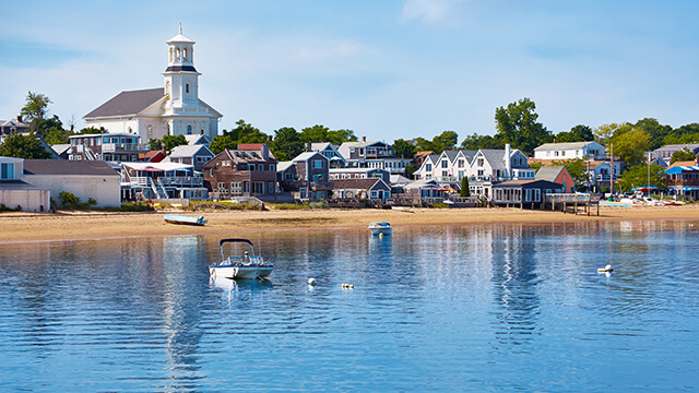The small town of Provincetown, Massachusetts with the beach and water in the foreground