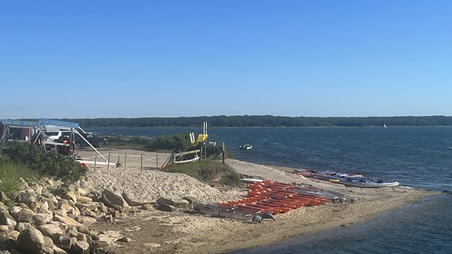 orange kayaks line the beach on Martha's Vineyard