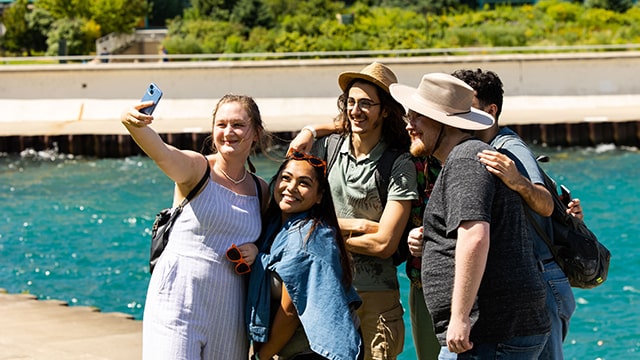 a group of travelers take a selfie together