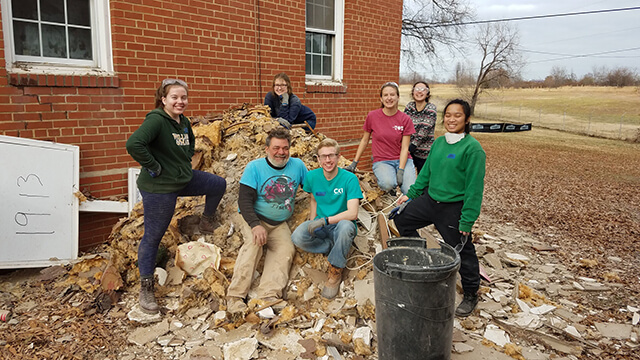 a group of volunteers on a home construction site