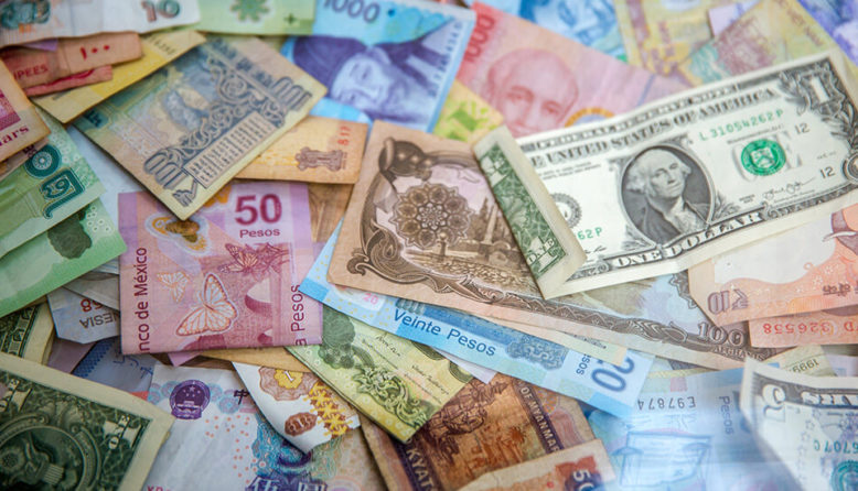 a variety of colorful currency from around the world